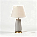 Table lamp with white fabric shade and ceramic base in 30 x 20 x 50cm